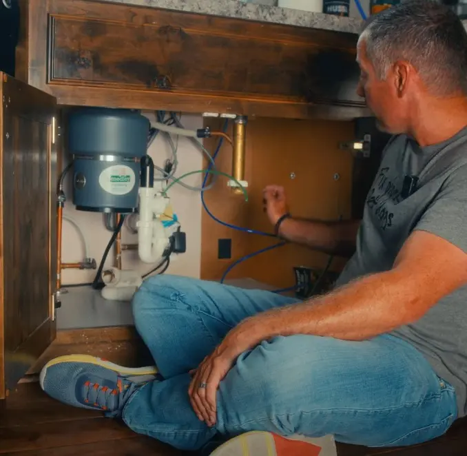 pro plumbers fixing heaters